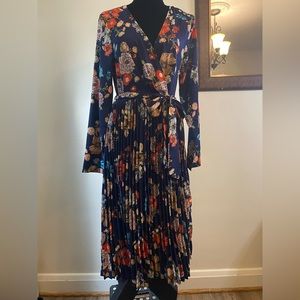 PLT Midi floral dress size US 10. Long sleeves belted pleated Navy color v neck.